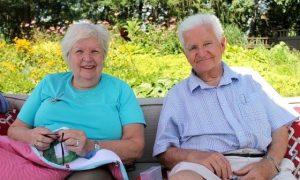 Anne and Peter sitting outside